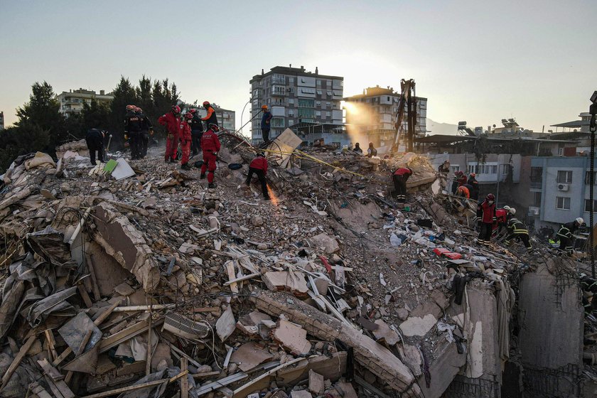 Rescue operations take place on a site after an earthquake struck the Aegean Sea, in the coastal pro