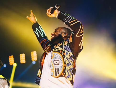 Davido wears a hand-beaded OKUNOREN jacket at his sold-out concert 