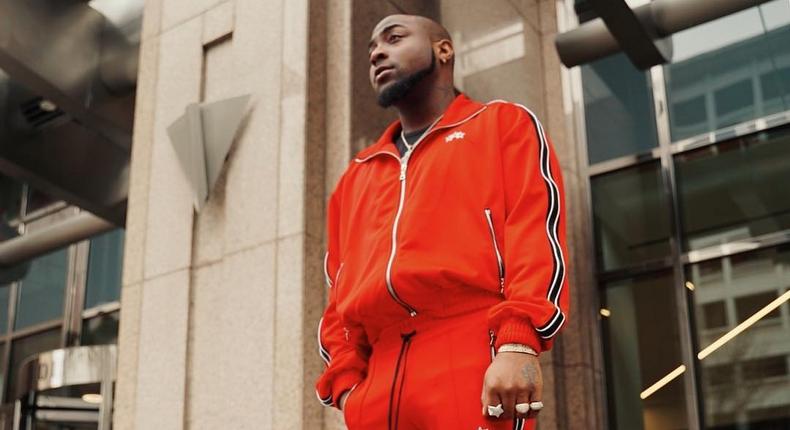 Davido displayed how much he appreciates a member of his crew with a new red benz. [Instagram/davidoofficial]