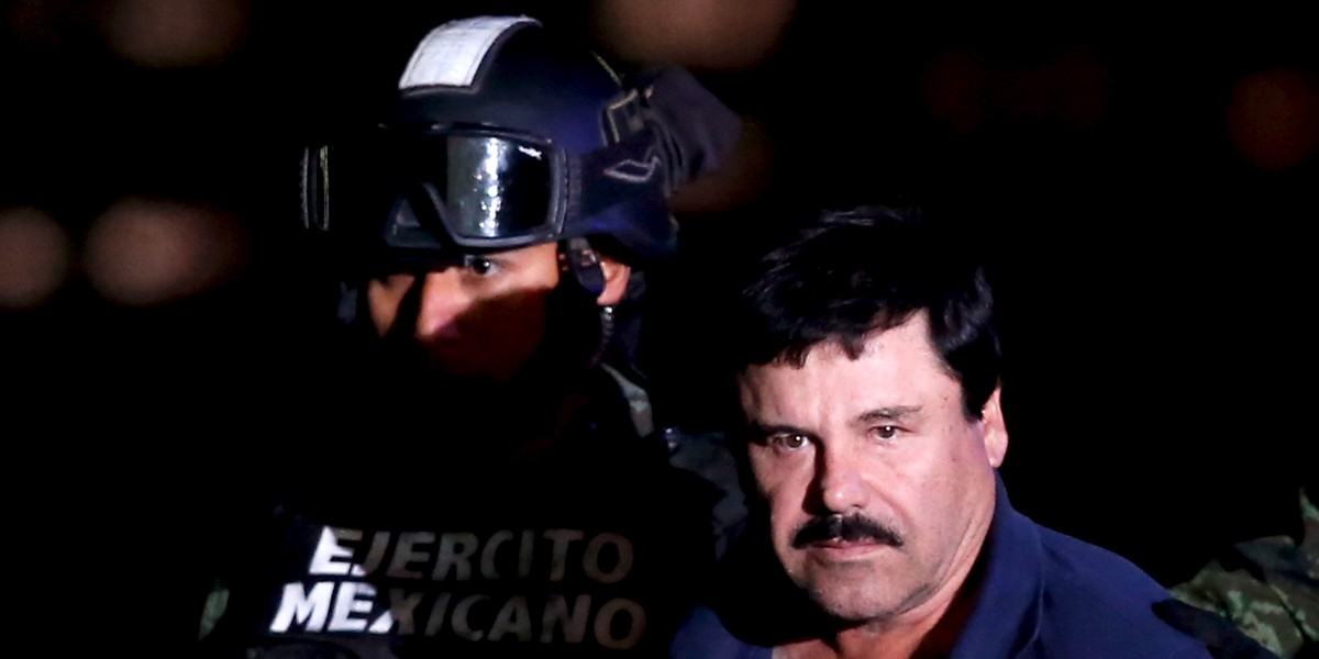 Joaquín "El Chapo" Guzmán is escorted by soldiers during a presentation at the hangar belonging to the office of the attorney general in Mexico City, Mexico, on January 8.