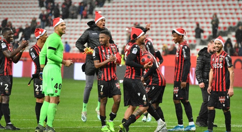 Nice celebrate their win with the offending festive hats