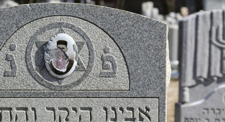 Vandalized stones are scattered at Stone Road or Waad Hakolel Cemetery in Rochester, New York on March 3, 2017