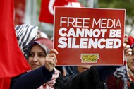 Supporters of Gulen movement shout slogans during a protest outside the Kanalturk and Bugun TV build