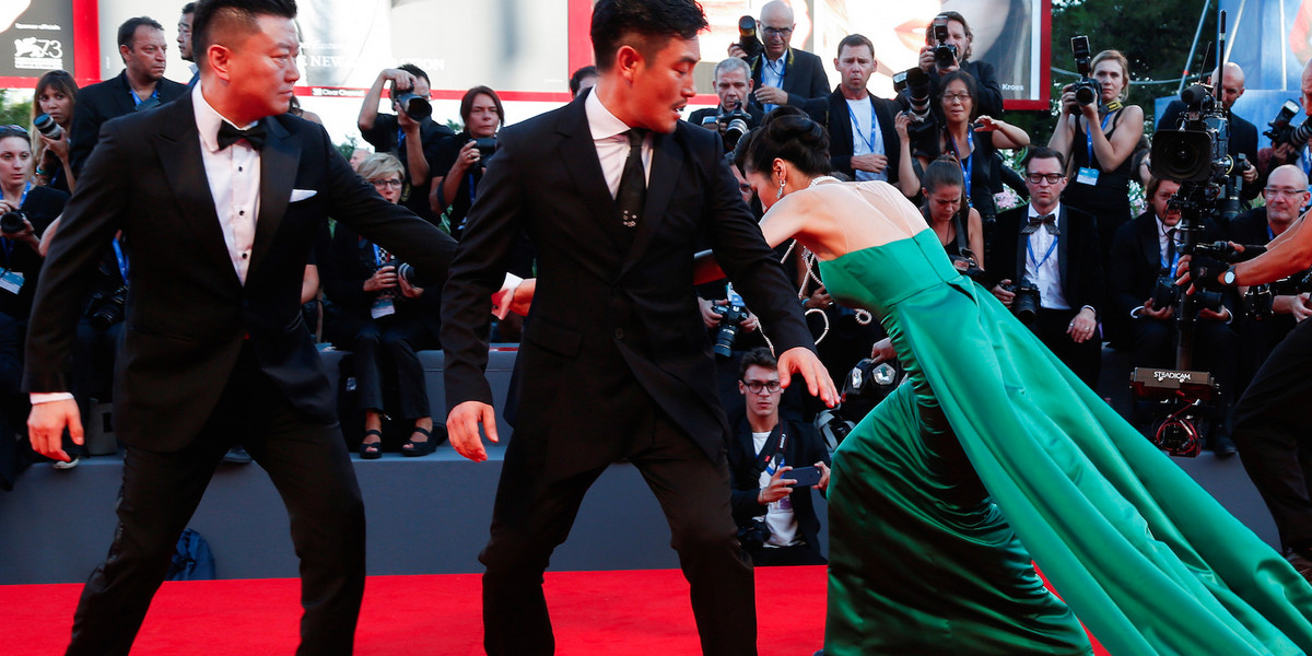 A guest falling during the red-carpet event for the movie "The Light Between Oceans" at the 73rd Venice Film Festival.