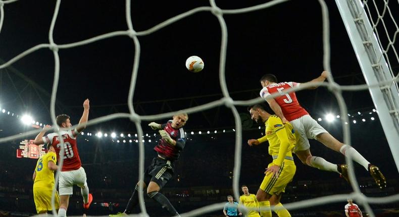 Sokratis scored Arsenal's decisive third goal to see them past BATE Borisov at the Emirates Stadium and into the Europa League last 16