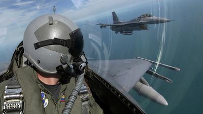 F-16 Fighting Falcons from the 62nd Fighter Squadron, Luke Air Force Base, Ariz., fly over southern Florida during a flight from Luke to Key West, Fla., Oct. 16, 2004.Stocktrek Images/Getty Images