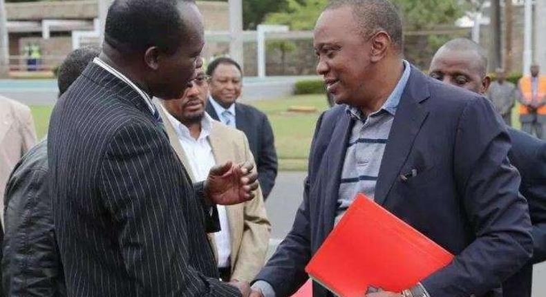 File image of Raphael Tuju with President Uhuru Kenyatta