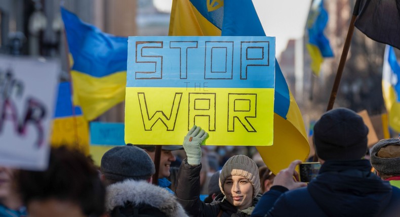 A demonstrator holds a sign during a peaceful stand for Ukraine rally in Boston, Massachusetts.Vincent Ricci/SOPA Images/LightRocket via Getty Images