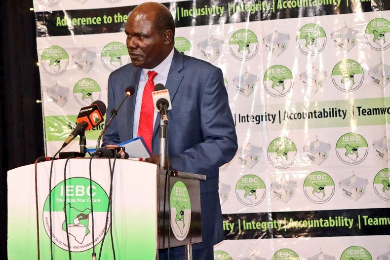 Outgoing IEBC Chair Wafula Chebukati and commissioners Boya Molu & Abdi Guliye during the launch of the Post-election Evaluation Report in Nairobi