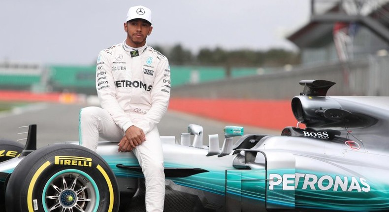 Lewis Hamilton pose with the Mercedes W08