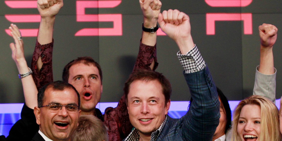 CEO of Tesla Motors Elon Musk waves after ringing the opening bell at the Nasdaq.