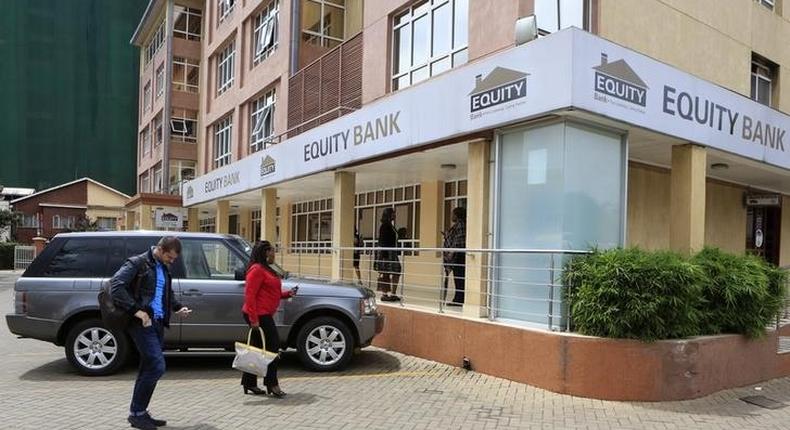 Customers arrive at a branch of the Equity Bank for money transactions in Kenya's capital Nairobi November 11, 2015. 