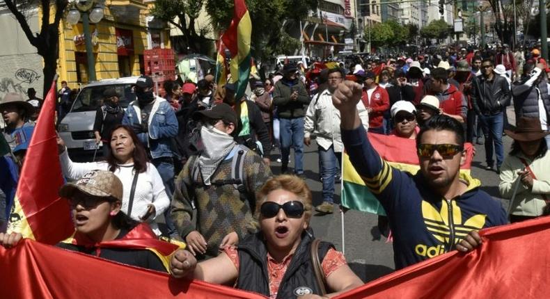 People march against the nomination of Bolivian President Evo Morales as candidate for reelection for the October 2019 elections, during a national strike, in La Paz, on December 6, 2018