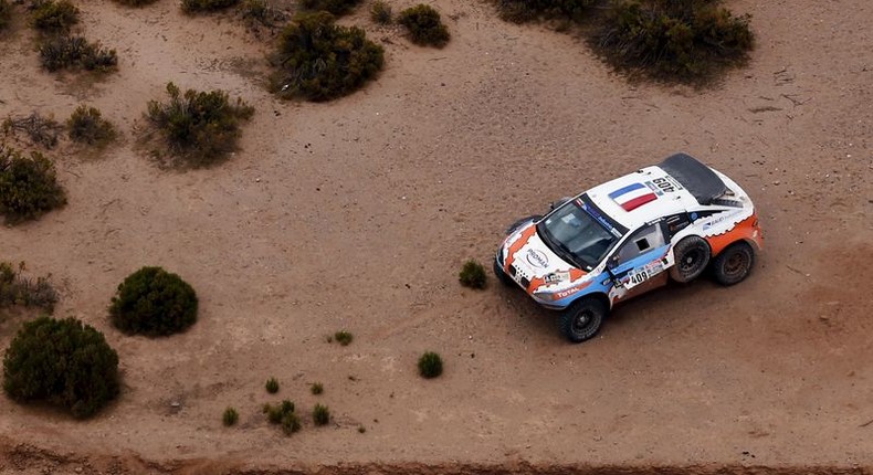 The Mitsubishi of Lionel Baud of France is seen on the side of the road during the seventh stage in the Dakar Rally 2016 near Uyuni, Bolivia, January 9, 2016. REUTERS/Marcos Brindicci