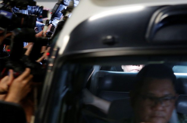 Former Hong Kong Chief Executive Donald Tsang is seen inside a prison van in Hong Kong