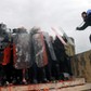 Protesters clash with police officers during a demonstration against the agreement reached by Greece