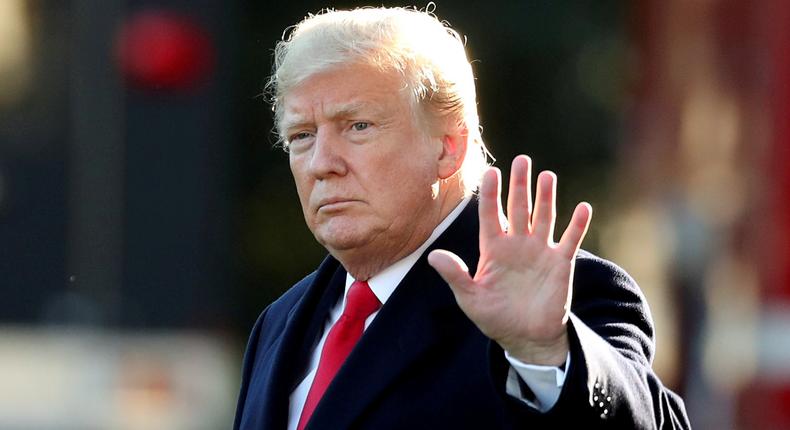 FILE PHOTO: U.S. President Donald Trump waves prior to departing on a trip to Wisconsin from the White House in Washington, U.S., October 24, 2018. REUTERS/Cathal McNaughton/File Photo