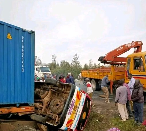 The accident scene at the Nakuru-Eldoret Highway involving two PSVs and a truck