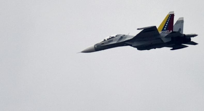 A Venezuelan Air Force Russian-made SU-30 fighter, like this one pictured over Caracas in 2013, is accused of jeopardizing the safety of the US crew and aircraft