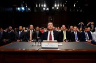 Former FBI Director Comey testifies before a Senate Intelligence Committee hearing in Washington