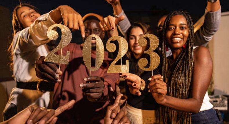 A group of happy friends celebrating New Year together 