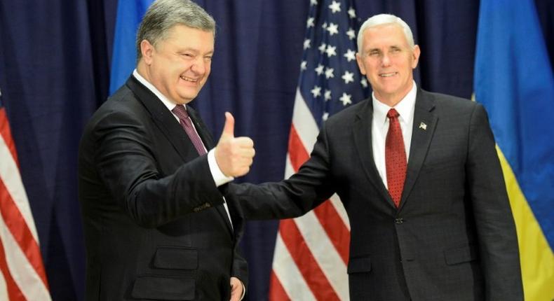 Ukraine President Petro Poroshenko (L) claims he had a very important meeting with US Vice President Mike Pence in Munich, on February 18, 2017