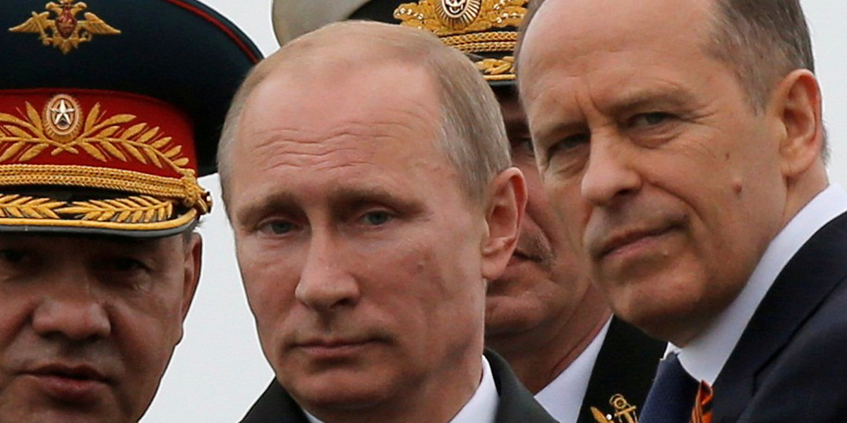 Russian President Vladimir Putin with Defense Minister Sergei Shoigu, left, and Federal Security Service Director Alexander Bortnikov.