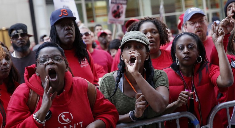 People demonstrate outside a Verizon wireless store during a strike in New York, U.S., April 18, 2016.