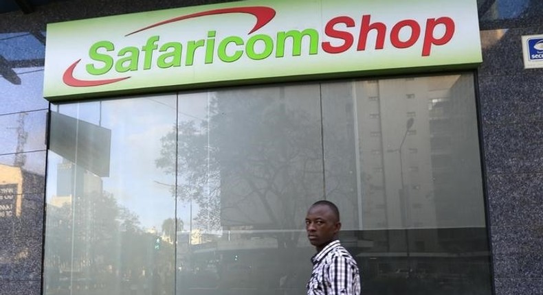 A man walks past a Safaricom shop, a mobile telecommunication provider in Kenya's capital Nairobi November 15, 2015. 