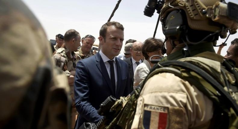 France is attempting to overcome US reservations about financial backing for anti-terrorism forces in the Sahel region of Africa, pictured in May 2017 when French President Emmanuel Macron (C), visited the French troops in northern Mali