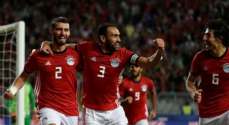 Egypt defenders Baher El-Mohamady (L) celebrates with his Ahmed Elmohamady (C) and Ahmed Hegazi (R) after scoring a goal during the Africa Cup of Nations qualifier football match against Tunisia near Alexandria November 16, 2018