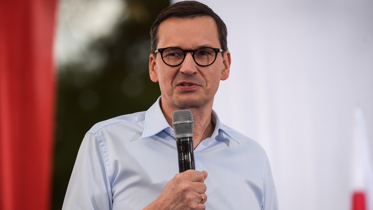 prompthunt: screenshot of a smiling muscular matusz morawiecki