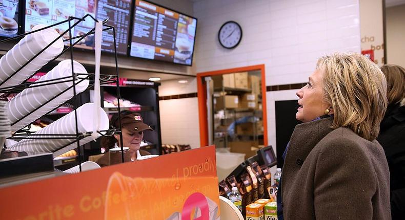 Democratic presidential candidate former Secretary of State Hillary Clinton orders food at a Dunkin' Donuts on February 9, 2016 in Nashua, New Hampshire. New Hampshire voters are heading to the polls in the nation's first primaries.