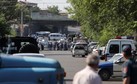 Policemen block a street after group of armed men seized a police station along with an unknown number of hostages, according the country's security service, in Yerevan, Armenia