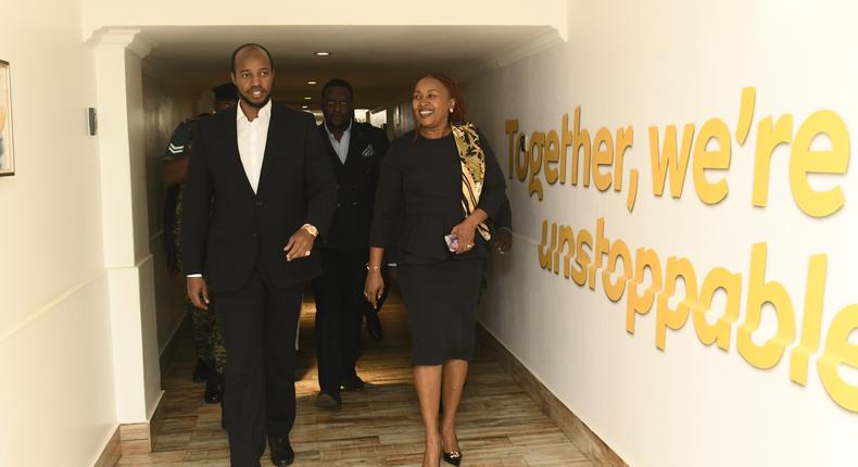 The MTN Uganda CEO (R) gives His Majesty King Oyo (L) a tour of the MTN Uganda head office