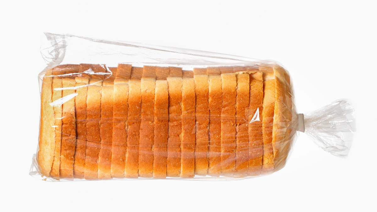 Sliced bread on white surface.