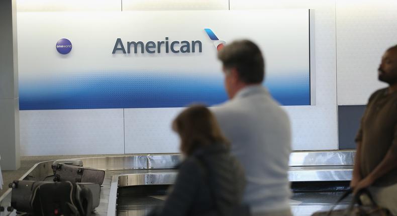 Passengers wait for their luggage after arriving on American Airlines flights at O'Hare International Airport on November 30, 2017 in Chicago, Illinois.