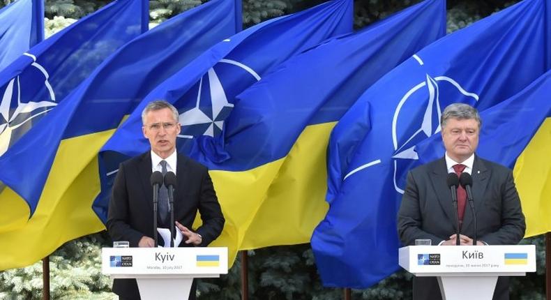 NATO chief Jens Stoltenberg (left) vowed at a press conference in Kiev with President Petro Poroshenko that the alliance stood by Ukraine