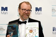 George Saunders, author of 'Lincoln in the Bardo', poses for photographers after winning the Man Booker Prize for Fiction 2017 in London