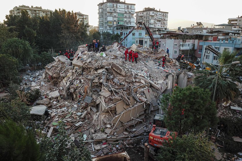 Rescue operations take place on a site after an earthquake struck the Aegean Sea, in the coastal pro