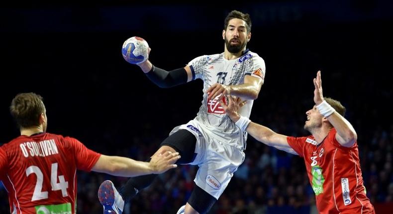 France's centre back Nikola Karabatic vies with Norway's pivot Bjarte Myrhol (R) during the 25th IHF Men's World Championship 2017 Group A handball match France vs Norway on January 15, 2017 at the Parc des Expositions in Nantes