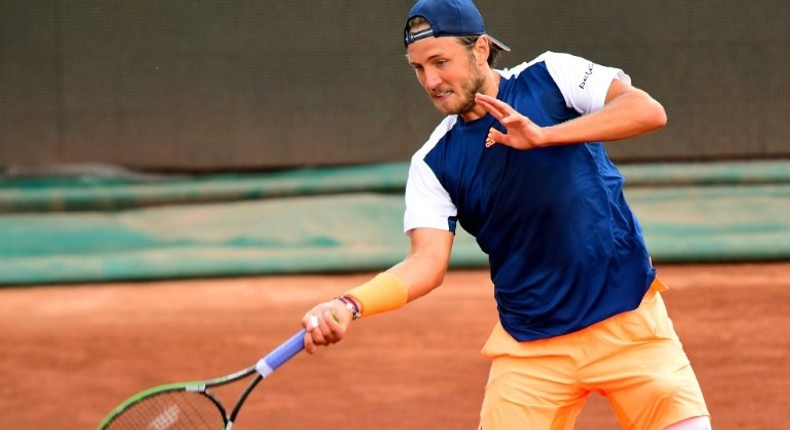 France's Lucas Pouille returns the ball to Britain's Aljaz Bedene during their final match at the Hungarian Open in Budapest, on April 30, 2017