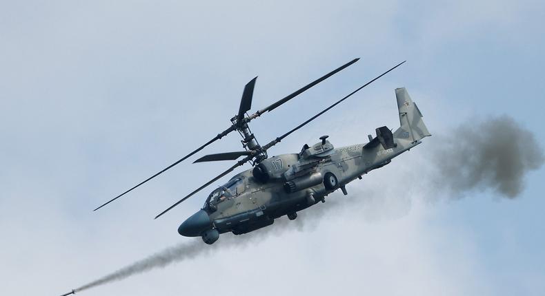 A Russian Ka-52 Alligator military helicopter fires a missile during the Aviadarts competition, as part of the International Army Games 2021, at the Dubrovichi range outside Ryazan, Russia August 27, 2021.REUTERS/Maxim Shemetov