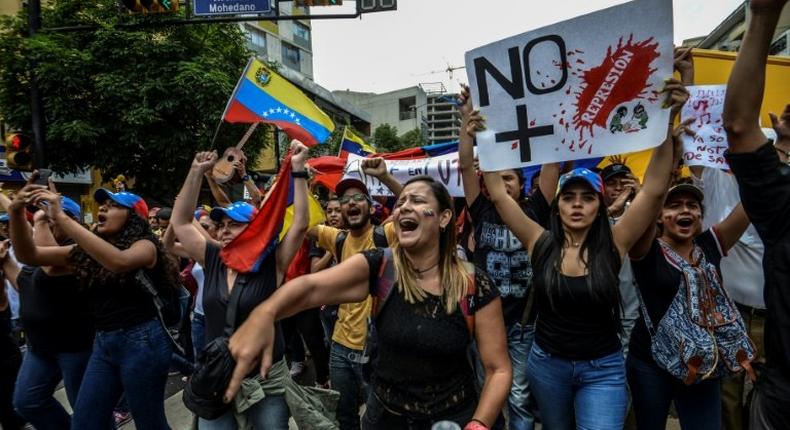 Venezuelan opposition activists protest in Caracas, on May 7, 2017