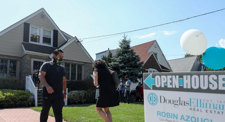 People wait to visit a house for sale in Floral Park, Nassau County, New York, the United States, on Sept. 6, 2020.