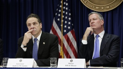 Andrew Cuomo (L) and New York Mayor Bill de Blasio