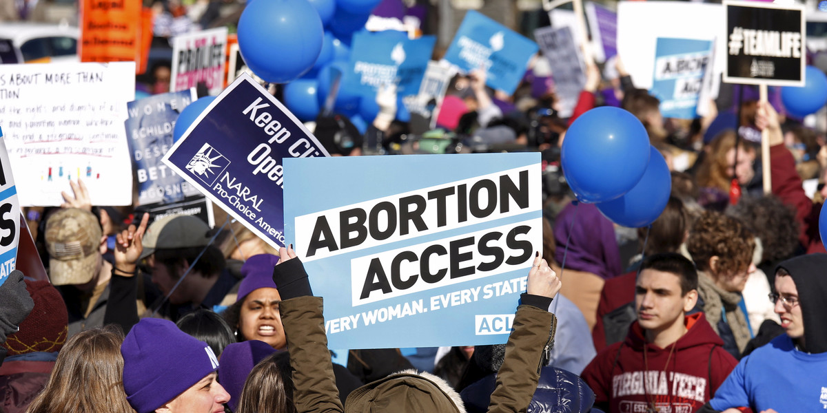 Protesters demonstrating in front of the US Supreme Court on March 2 as the court took up a major abortion case focusing on whether a Texas law that imposes strict regulations on abortion doctors and clinic buildings interferes with the constitutional right of a woman to end her pregnancy.