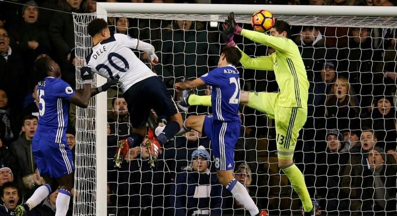Tottenham Hotspur's midfielder Dele Alli (2nd L) jumps to score his and Totenham's second goal with this header during the English Premier League football match between Tottenham Hotspur and Chelsea at White Hart Lane in London, on January 4, 2017