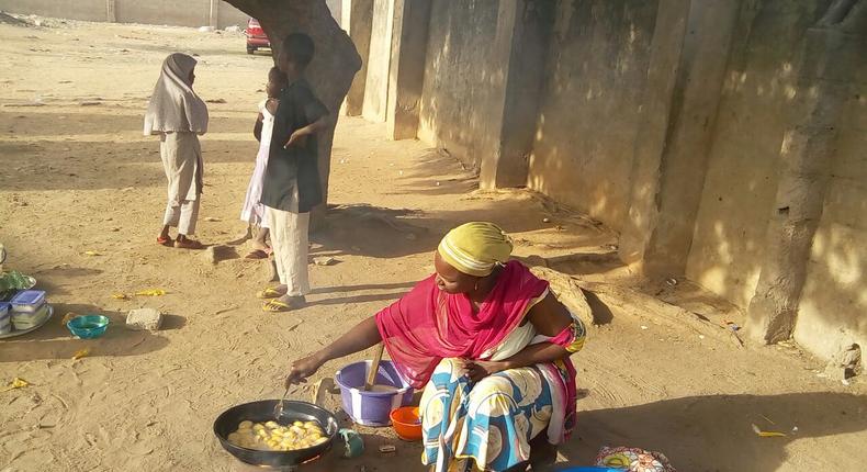 Mrs. Kwaramba Bitrus who lost five children and husband to Boko Haram struggling for survival through her beans cake business in Mubi town. 