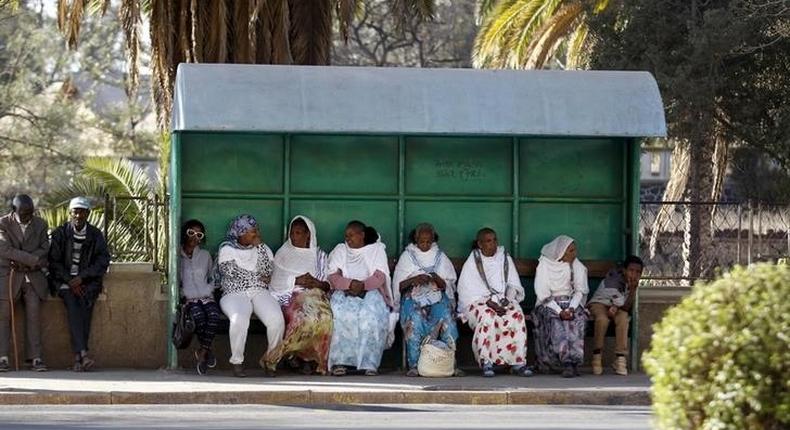 Passangers wait for public transport at a bus-stop in Eritrea's capital Asmara, February 20, 2016. ERITREA-POLITICS/ REUTERS/Thomas Mukoya